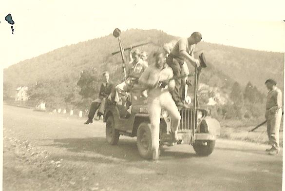 Howard Snyder jumping out of a jeep while fighting with the Maquis in 1944